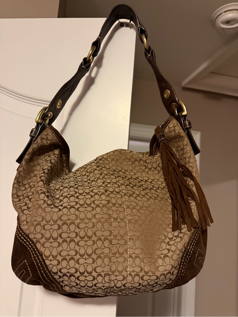 Coach Signature Canvas Shoulder Bag in Brown with Tassel